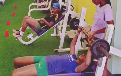 Girls being instructed in weight training in the gym renovated by The Foundation